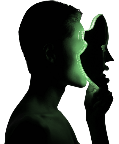 Silhouetted person holding a translucent mask with green lighting effect