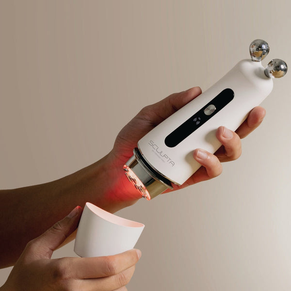 Sculpta by Déesse PRO handheld sculpting device with dual metal spheres and red LED